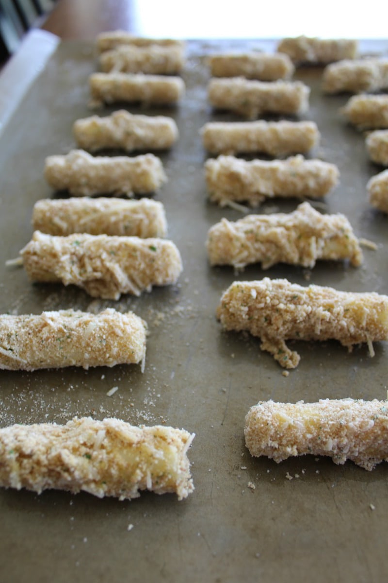 To bread the cheese sticks: First dip the frozen cheese stick into the flour, then into the egg, then into the bread crumb mixture To bread the cheese sticks: First dip the frozen cheese stick into the flour, then into the egg, then into the bread crumb mixture