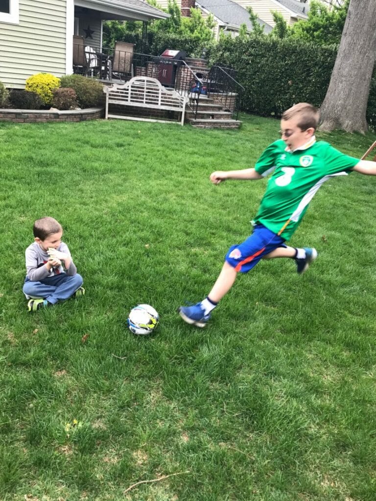 kids playing soccer and being active outside