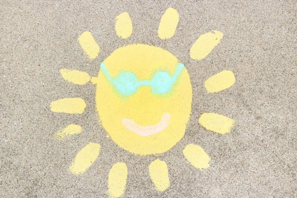 sun painted on driveway with chalk paint