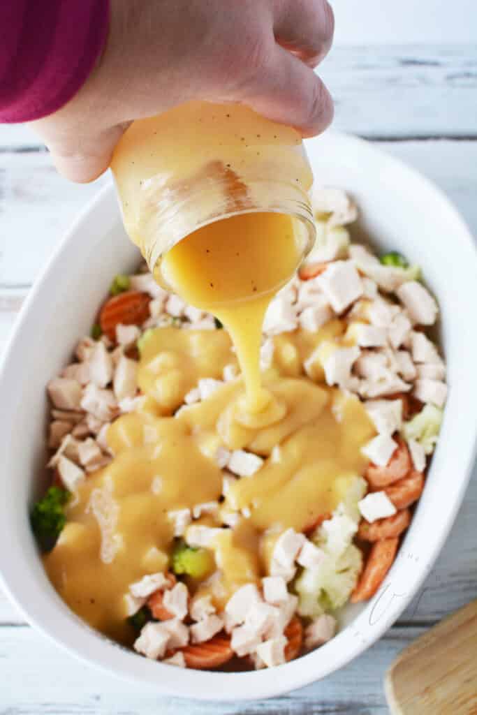 Pour gravy over turkey and vegetables in casserole dish