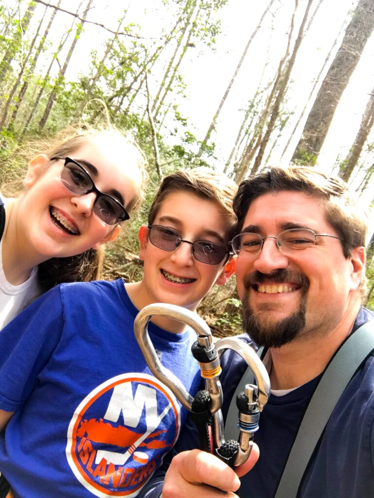 Family taking a selfie while zip lining