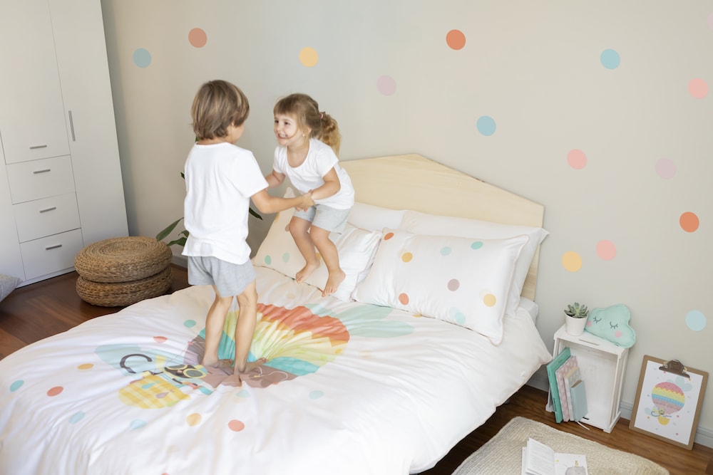 Wriggly Toes Organic Children's Bedding - booy and girl jumping
