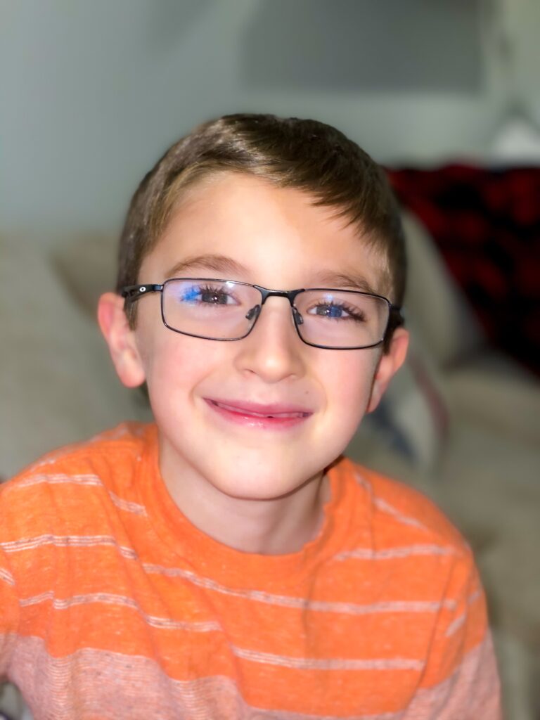 young boy in eyeglasses